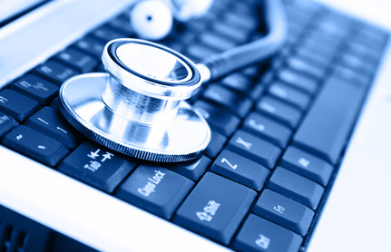 Close-up of stethoscope on laptop keyboard