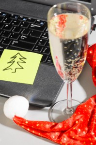 laptop with santa hat and wine